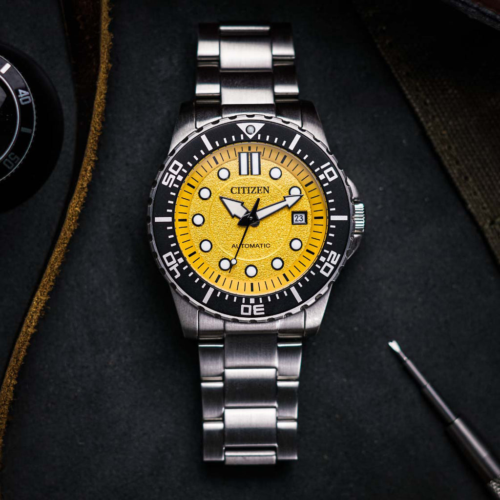 CITIZEN NJ0170-83Z - ELEGANT AUTOMATIC TIMEPIECE WITH STRIKING YELLOW DIAL & SILVER STAINLESS STEEL BAND