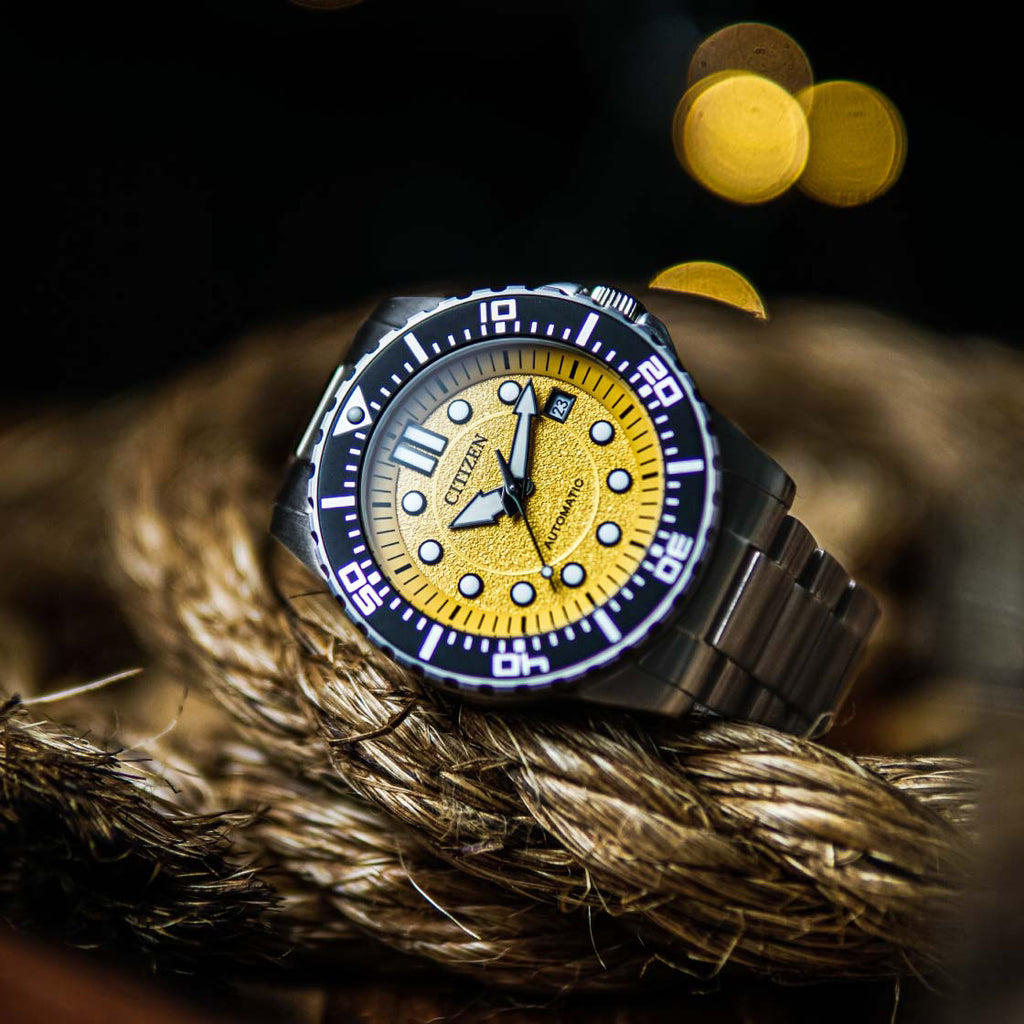 CITIZEN NJ0170-83Z - ELEGANT AUTOMATIC TIMEPIECE WITH STRIKING YELLOW DIAL & SILVER STAINLESS STEEL BAND
