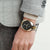 CITIZEN BI5094-59E - ELEGANT POWERHOUSE: Men's Stylish Silver & Gold Watch with Bold Black Dial