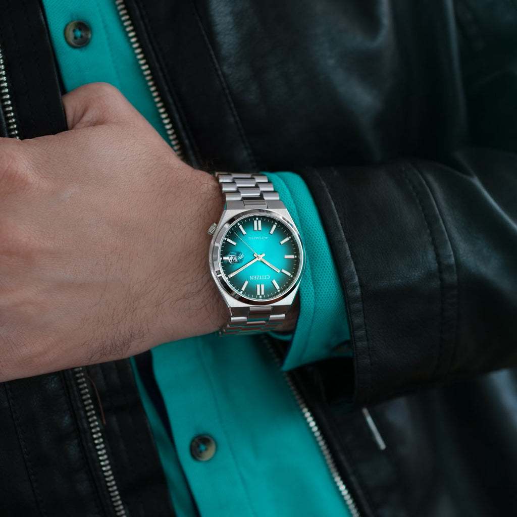 CITIZEN NJ0151-88X AUTOMATIC - MODERN SILVER TIMEPIECE WITH TURQUOISE DIAL
